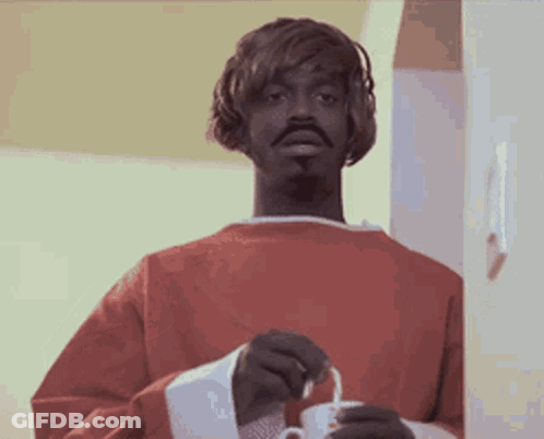 Man In Red Sweater Holding White Cup GIF