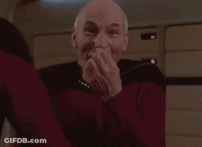 Man In Red Sweater Laughing Hands Over Mouth GIF