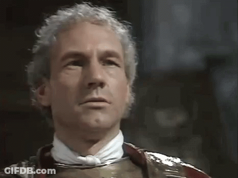 Man In Red Sweater Making Funny Face At Window GIF