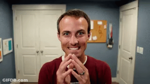 Man In Red Sweater Making Funny Face GIF