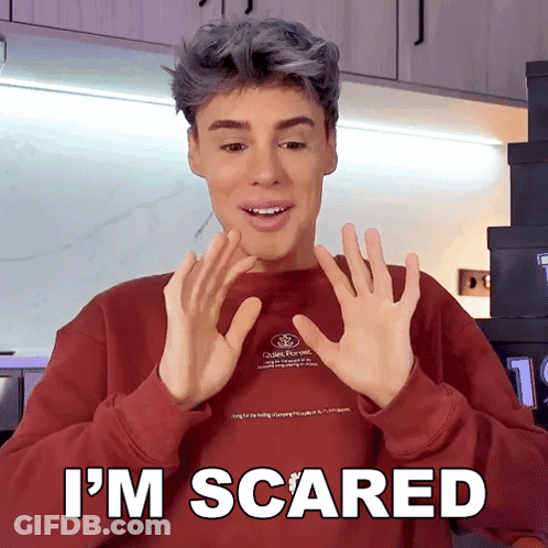Man In Red Sweater Saying Im Scared GIF