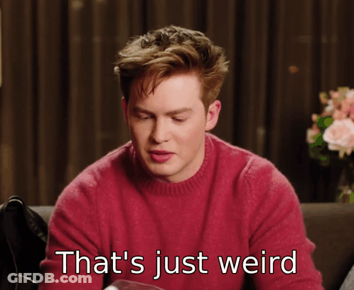 Man In Red Sweater Saying That's Weird GIF