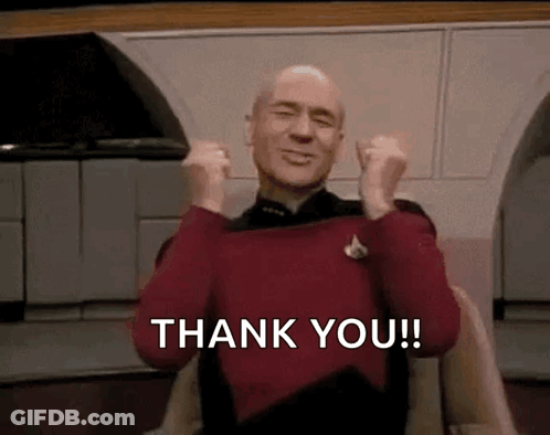 Man In Red Sweater Sitting With Arms Up Saying Thank You GIF