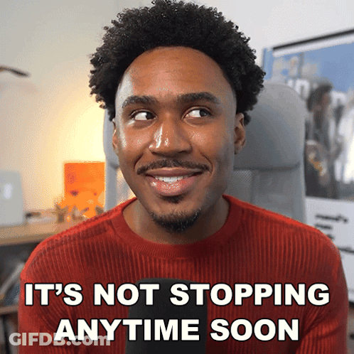 Man In Red Sweater Smiling It's Not Stopping Anytime Soon GIF