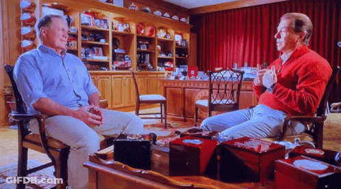 Man In Red Sweater Talking To Another Man GIF