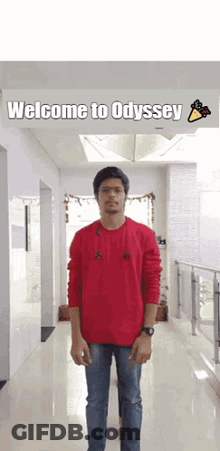 Man In Red Sweater With Welcome To Odyssey Sign GIF