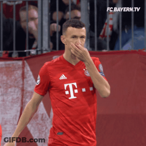 Man In Red T-Mobile Jersey Covering Nose GIF