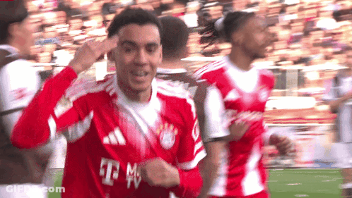 Man In Red T-Mobile Jersey Pointing GIF