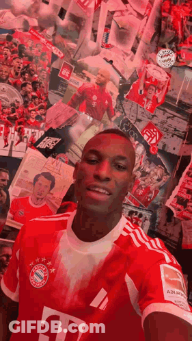 Man In Red T-Mobile Jersey Taking Selfie At Picture Wall GIF
