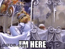 Man In Red T-Shirt With C Walking Down Sidewalk GIF