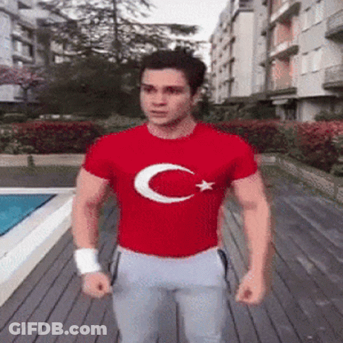 Man In Red T-Shirt With Crescent Moon And Star GIF