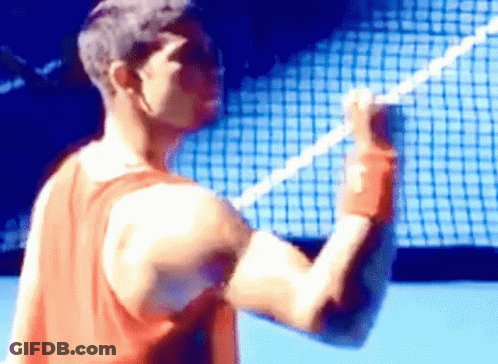 Man In Red Tank Top Holding Tennis Racquet GIF