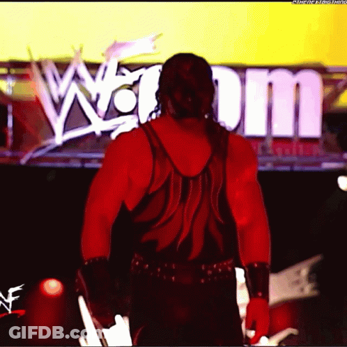 Man In Red Tank Top In Front Of Sign Saying W GIF