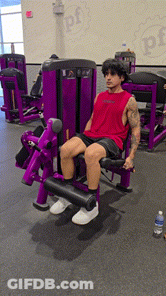 Man In Red Tank Top On Purple Machine GIF