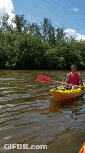 Man In Red Tank Top Paddling Yellow Kayak GIF