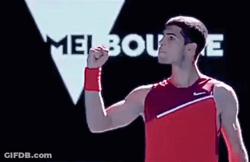 Man In Red Tank Top Raising Fist Melbourne Sign GIF