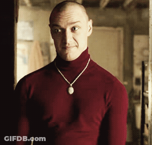 Man In Red Turtleneck And Necklace With Pendant GIF