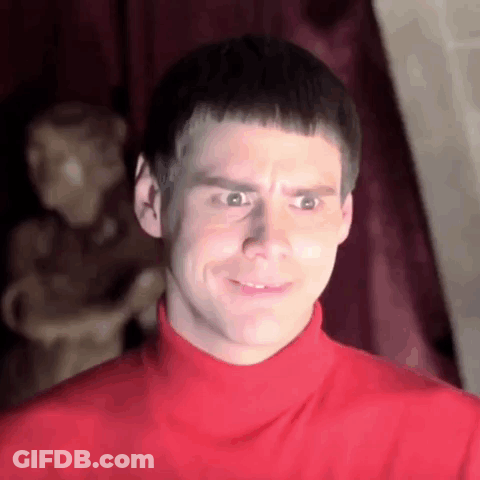 Man In Red Turtleneck Making Funny Face At Statue GIF