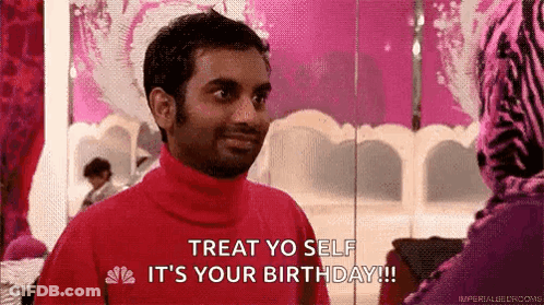 Man In Red Turtleneck Talking To Woman In Pink Zebra Dress GIF