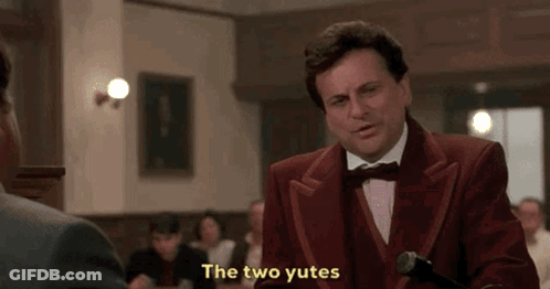 Man In Red Tuxedo Talking To Another Man In Restaurant GIF