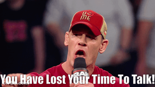 Man In Red U.S. Me Hat Talking Into Microphone Saying You Have Lost Your Time To Talk GIF