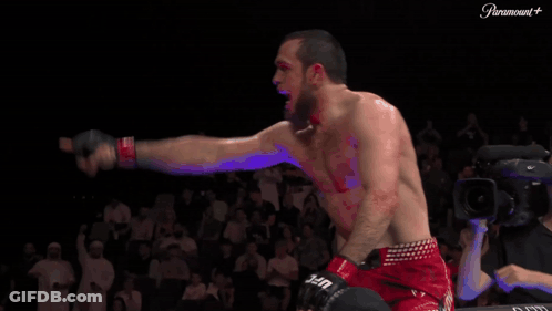 Man In Red UFC Shorts Standing In Front Of Crowd GIF