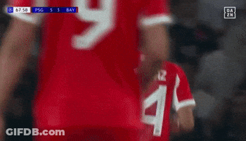 Man In Red Umbro Shirt At Empty Bleachers GIF