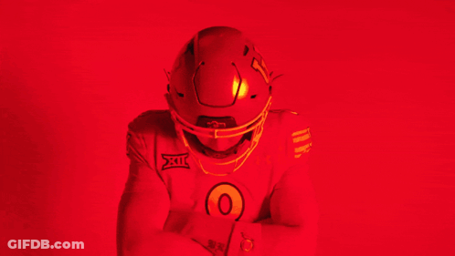 Man In Red Under Armour Jersey And Football Helmet GIF