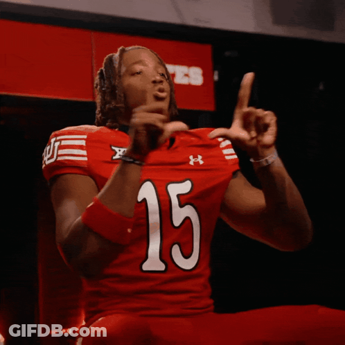 Man In Red Under Armour Jersey Number 15 GIF