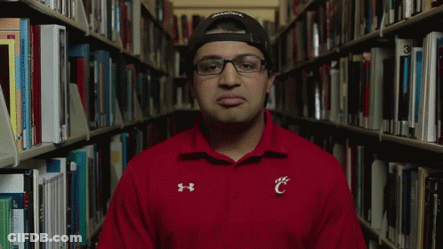 Man In Red Under Armour Shirt With C On Chest GIF