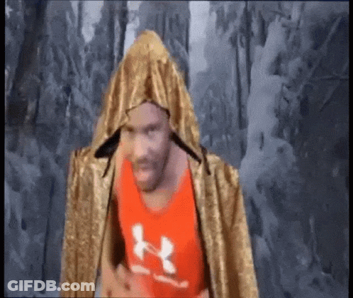 Man In Red Under Armour Tank Top And Gold Cape GIF