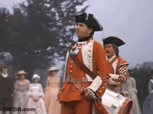 Man In Red Uniform Holding Drum In Front Of Crowd GIF