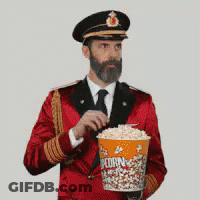 Man In Red Uniform Holding Popcorn Bucket GIF