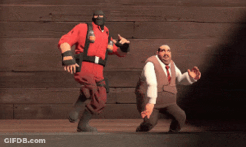 Man In Red Uniform Next To Man In Suit And Tie GIF