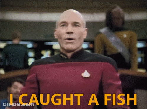 Man In Red Uniform Says I Caught A Fish GIF