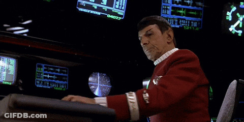 Man In Red Uniform Sitting At Desk With Monitor Saying 04077 GIF