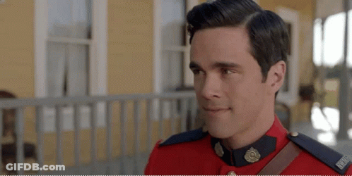 Man In Red Uniform Standing On Porch GIF