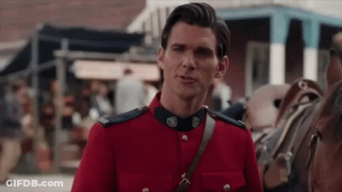 Man In Red Uniform Talking To Horse GIF