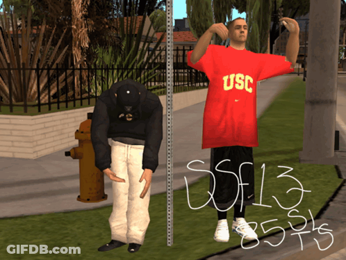 Man In Red USC Shirt Next To Man In Black Hat GIF
