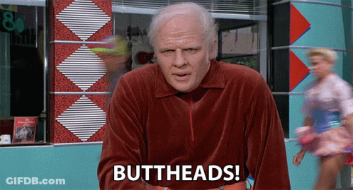 Man In Red Velvet Shirt Says Buttheads In Front Of Diner GIF