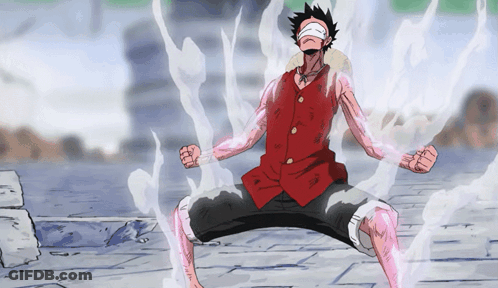 Man In Red Vest Kneeling With Eyes Covered GIF