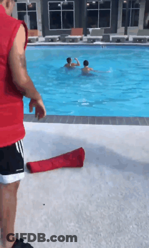Man In Red Vest Next To Pool GIF