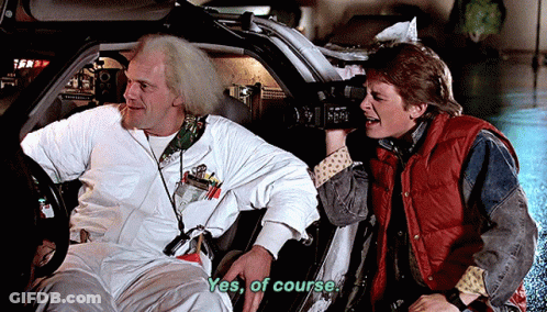 Man In Red Vest Saying Yes Of Course In Car GIF