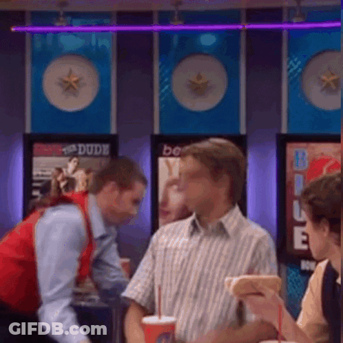 Man In Red Vest Talking GIF