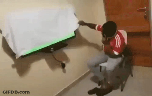 Man In Red White Adidas Shirt Watching TV GIF