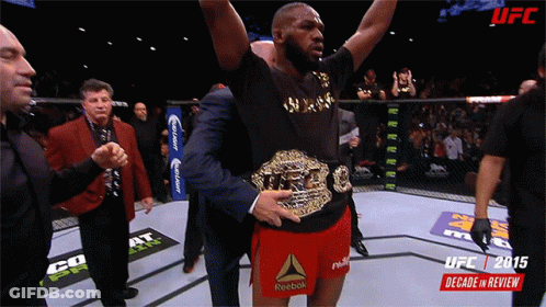Man In Reebok Shorts Holding UFC Belt GIF