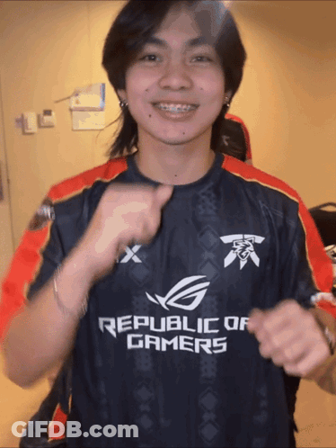Man In Republic Of Gamers Shirt Pumping Fist GIF