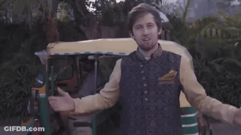Man In Rickshaw Giving Peace Sign GIF