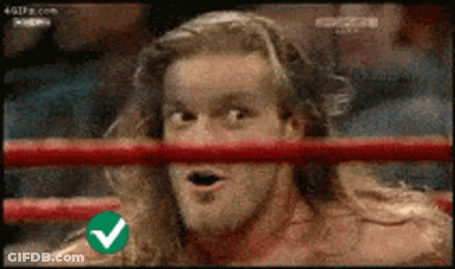 Man In Ring With Green Check Mark On Shoulder GIF