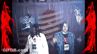 Man In Rita Uni T-Shirt Next To Another Man GIF